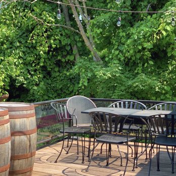 Village Hands Cafe - a patio with tables and chairs - Coffee Roasteries Near Me - Monroe, New York