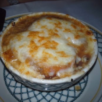 The Cellar Restaurant - Traditional French onion soup baked over with gruyère cheese. - French Near Me - Fullerton, California The Cellar Restaurant - Traditional French onion soup baked over with gruyère cheese. - French Near Me - Fullerton, California