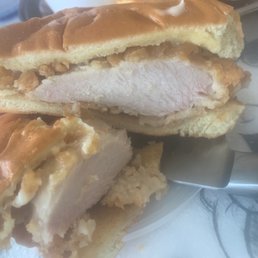 a chicken sandwich cut in half a chicken sandwich cut in half