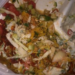 a plastic container filled with food a plastic container filled with food
