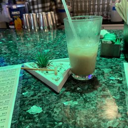a drink on a bar counter a drink on a bar counter
