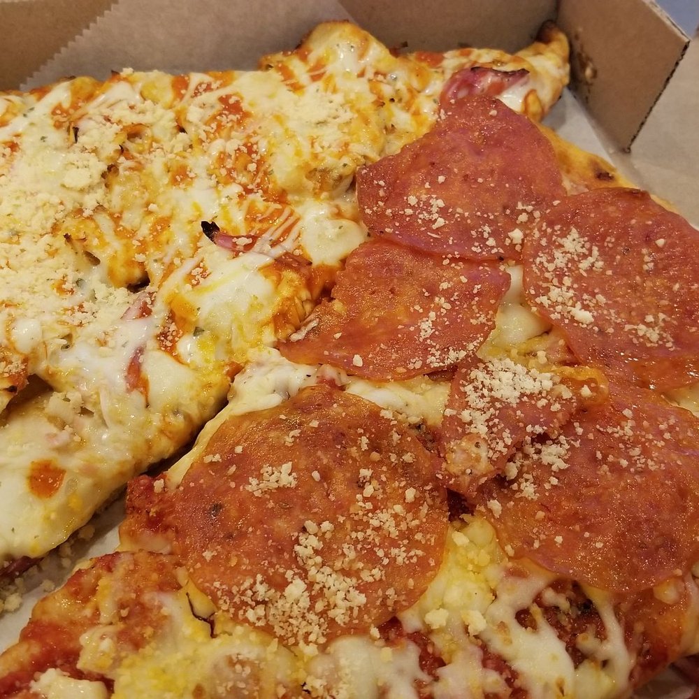 Slice of pepperoni, and a slice of buffalo chicken Slice of pepperoni, and a slice of buffalo chicken