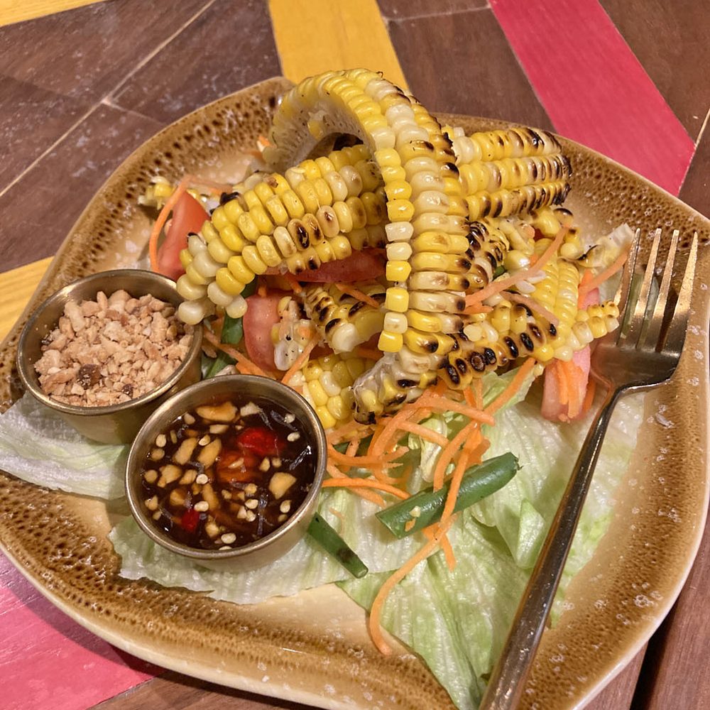 Pii Nong - Grilled Corn Salad (grilled local sweet corn, mixed with lettuce, long beans, carrots, tomatoes, peanuts, garlic, and tamarind dressing) - Thai Near Me - Toronto, Ontario Pii Nong - Grilled Corn Salad (grilled local sweet corn, mixed with lettuce, long beans, carrots, tomatoes, peanuts, garlic, and tamarind dressing) - Thai Near Me - Toronto, Ontario