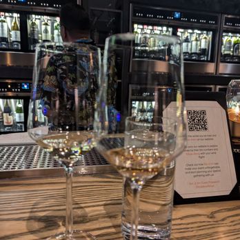 Bar à Vin - Whites on parade in one ounce samples. Note the cooler full of wines. - Wine Bars Near Me - Salt Lake City, Utah