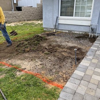 Fern's Complete Landscape & Construction Services - Removing small rocks and carving space for the new planter - Landscaping Near Me Fern's Complete Landscape & Construction Services - Removing small rocks and carving space for the new planter - Landscaping Near Me