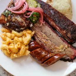Mac and cheese, pickles, chipotle sausage, brisket, rib and tortillas.