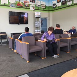 County Line Nissan - Service waiting area with large screen TV