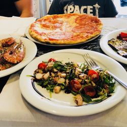 Ristorante Volare - Front is the octopus salad, left are the grilled prawns, the pizza Diablo and right are the grilled veggies. All delish!