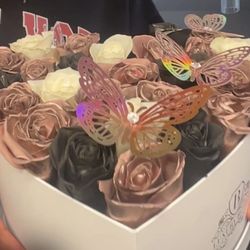 Brenda's Flowers - Black, rose gold, and white roses with 3 rose gold butterflies arranged in a heart box