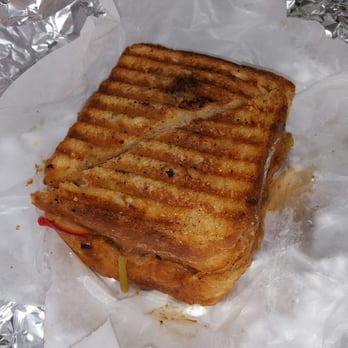 Love Handle - My "Benedyk" sandwich. Pulled pork shoulder, braided turnip tops, tang turnip & radish, and plum bbq sauce. (Took it to go, hence the foil) - Delis Near Me - Indianapolis, Indiana