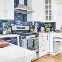 AFTER photo of our Kitchen Makeover with cabinets expertly painted white by Paper Moon Painting. Photography by The Pillow Goddess. AFTER photo of our Kitchen Makeover with cabinets expertly painted white by Paper Moon Painting. Photography by The Pillow Goddess.