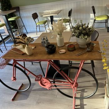 Othello’s Plant Based Kitchen - Cute entryway bike table decor - Vegan Near Me - Woodland Hills, California Othello’s Plant Based Kitchen - Cute entryway bike table decor - Vegan Near Me - Woodland Hills, California
