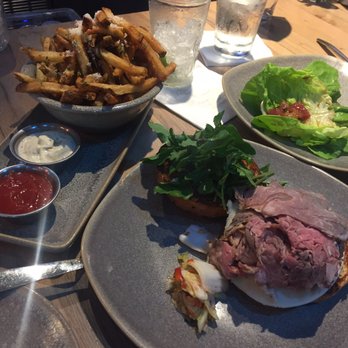 Moku Kitchen - Garlic truffle fries and prime rib sandwich - Cocktail Bars Near Me - Honolulu, Hawaii