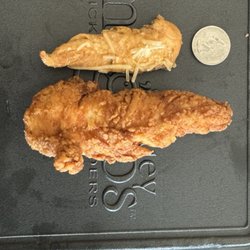 Huey Magoos Chicken Tenders - Arden - Grilled tender vs hand breaded tender (Quarter for size reference).