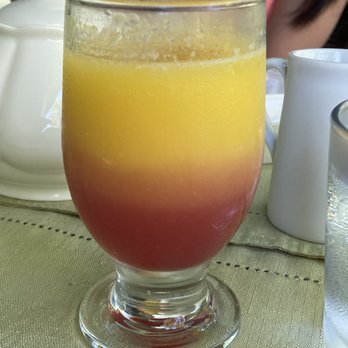 Candleberry Inn on Cape Cod - The Brewster Sunrise drink (OJ & cranberry juice). - Bed & Breakfast Near Me - Brewster, Massachusetts