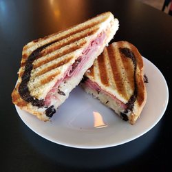 Jef's Cafe - The Reuben Sandwich for $8.95 in 2021. The bread is not burned, the black part is marbling in different patterns.