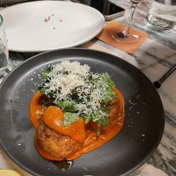 Parla - a plate of food on a table - Pizza Near Me - New York, New York