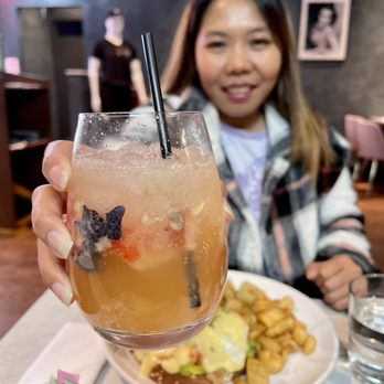 360 brunch house - a woman holding up a drink - Breakfast & Brunch Near Me - Dallas, Texas 360 brunch house - a woman holding up a drink - Breakfast & Brunch Near Me - Dallas, Texas