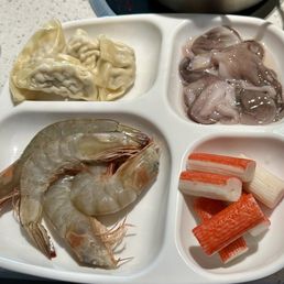 A plate of seafood. The shrimp and pork dumpling were very good. A plate of seafood. The shrimp and pork dumpling were very good.