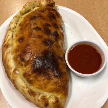 Primavera Pizza - White Calzone. - Italian Near Me - Matthews, North Carolina Primavera Pizza - White Calzone. - Italian Near Me - Matthews, North Carolina