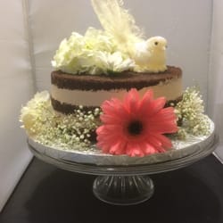 Chocolate birthday cake with fresh flowers from East Bay Flowers.
