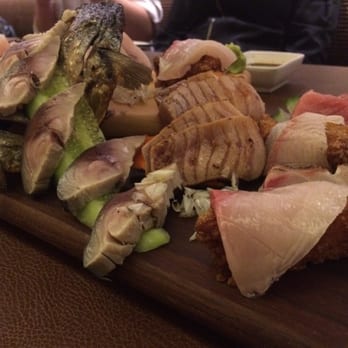 JaBistro - $100 with a decorative piece of fried rice under the piece of snapper at foreground - Japanese Near Me - Toronto, Ontario