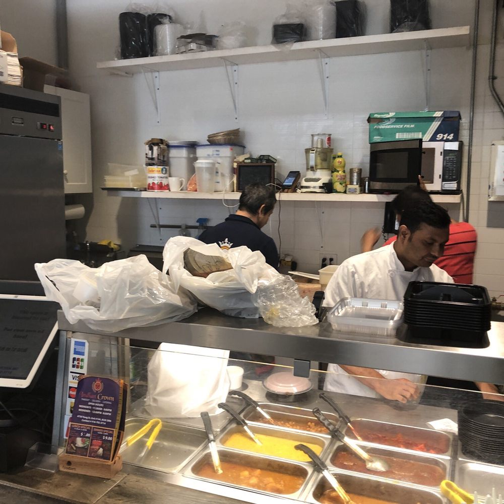 Indian Crown - a man and a woman working in a restaurant kitchen - Indian Near Me - Toronto, Ontario Indian Crown - a man and a woman working in a restaurant kitchen - Indian Near Me - Toronto, Ontario