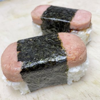 Bak's Kitchen - two pieces of sushi on a cutting board - Japanese Near Me - Los Angeles, California Bak's Kitchen - two pieces of sushi on a cutting board - Japanese Near Me - Los Angeles, California