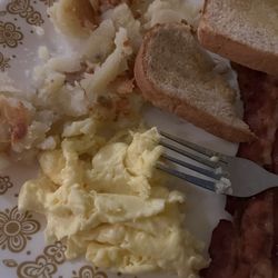 Bacon, eggs, toast, potatoes