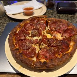 Bleachers Sports Bar Grill & Pizzeria - Individual pepperoni pizza.