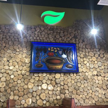 The Grain Cafe - Inside the Grain Cafe (the wood logs add a nice contrast to the wooden blue panel) - Pizza Near Me - Redondo Beach, California