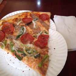Italian slice next to a napkin for size comparison. It's huge!