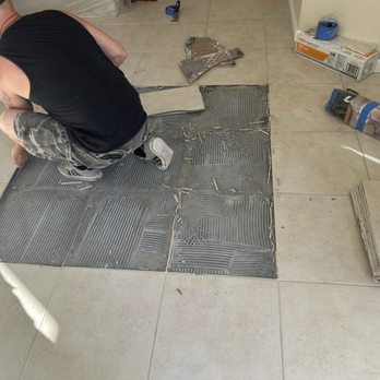 Coastal flooring and interiors - George Starting the tear-rout of old tile - Flooring Near Me