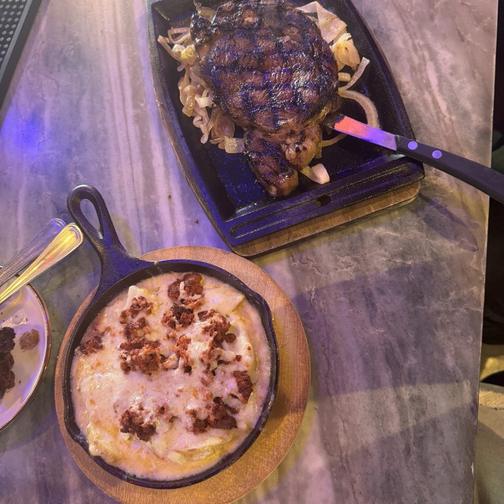 Coconut Grove - Pacific coat rib eye with chorizo at gratin potatoes - Comfort Food Near Me - Kemah, Texas