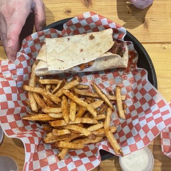 When Pigs Fly BBQ - Macaroni and meat burrito almost. Fries. Amazing. Fries are similar but better than 5 guys. - Barbeque Near Me - Monroe, Georgia