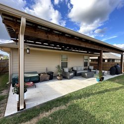 3:12 Custom Exteriors - 39x10' concrete slab with cedar pergola on risers with electrical ran for outlets and fans installed. (not gutters)