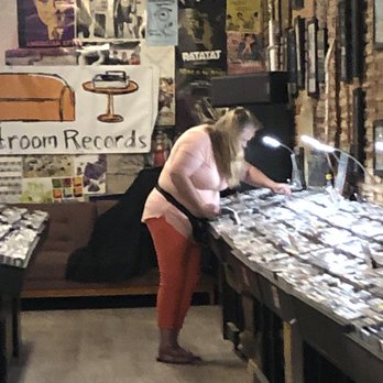 Guestroom Records-Norman - Beth sifting through glorious inventory! - Books, Mags, Music & Video Near Me - Norman, Oklahoma