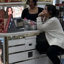 Make up counter girls there's three of them, but you can't see the third one. Make up counter girls there's three of them, but you can't see the third one.