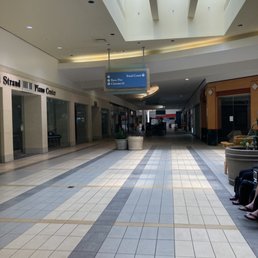 All stores are boarded up and hallways are dark.