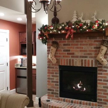 Jail Hill Inn - Fireplace decorated for Christmas. - Bed & Breakfast Near Me - Galena, Illinois