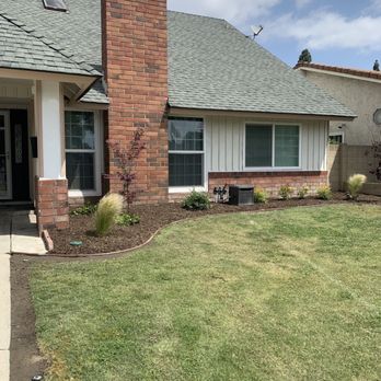 Robert's Complete Care - After: leveled surface, drip irrigation, new sprinkler system with remote, border, and mulch. - Landscaping Near Me
