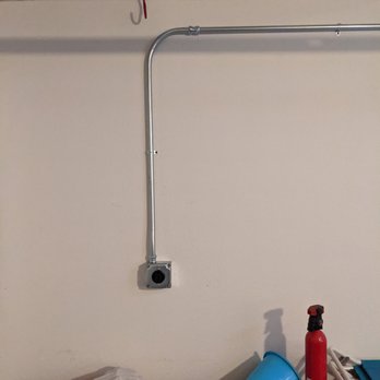 Wave Electric - The NEMA 14-50 240V plug coming from our panel on the side of the garage for the car charger - Electricians Near Me