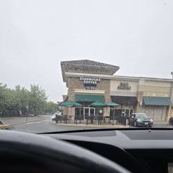 Starbucks - Front entrance and patio seating.