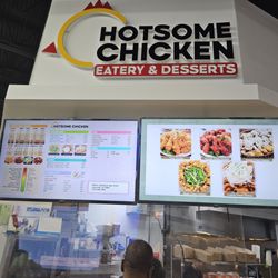 Hot Some Chicken - Front of restaurant with menu.