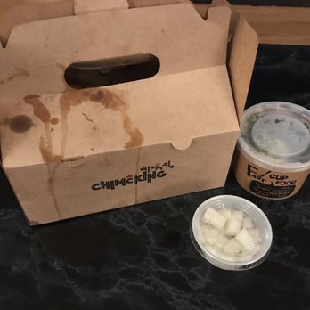ChimcKing - Grease stain on container, not the most appealing. Side of pickle radish. Chimcking rice. - Chicken Wings Near Me - Beaverton, Oregon