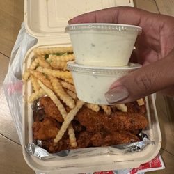 American Deli - The 15 piece combo only comes with one ranch. It's $1.50 for an extra ranch. There's celery under the fries.