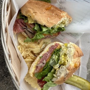 The Garage - On a hoagie: pastrami, cheddar, pepper Jack, spicy mustard, lettuce, pepperoncini, jalapeños, salt & pepper - Sandwiches Near Me - Birmingham, Alabama The Garage - On a hoagie: pastrami, cheddar, pepper Jack, spicy mustard, lettuce, pepperoncini, jalapeños, salt & pepper - Sandwiches Near Me - Birmingham, Alabama