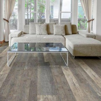 Douthat Flooring - a living room with a couch and coffee table - Flooring Near Me - Clearwater, Florida