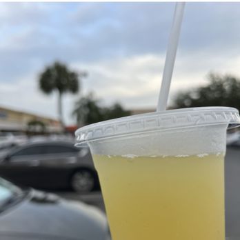 Munchies Cafe - a person holding a drink - Cuban Near Me - Miami, Florida Munchies Cafe - a person holding a drink - Cuban Near Me - Miami, Florida