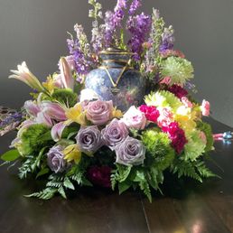 Meadows of memories wreath. All purple in the picture online but since the urn was already purple I asked for more color Meadows of memories wreath. All purple in the picture online but since the urn was already purple I asked for more color